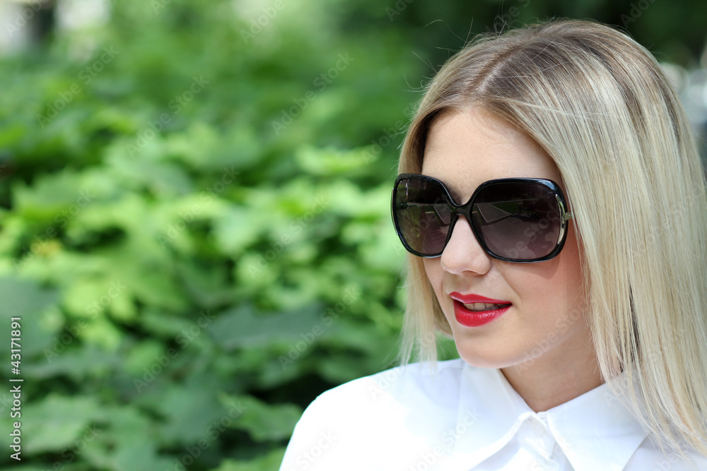 Beautiful young woman in sunglasses. Outdoor portrait Beautiful young woman in sunglasses. Outdoor portrait