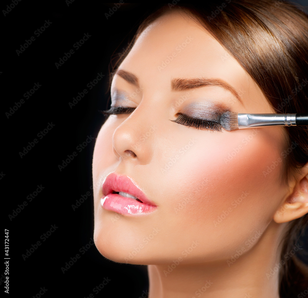 Make-up applying. Eye shadow brush
