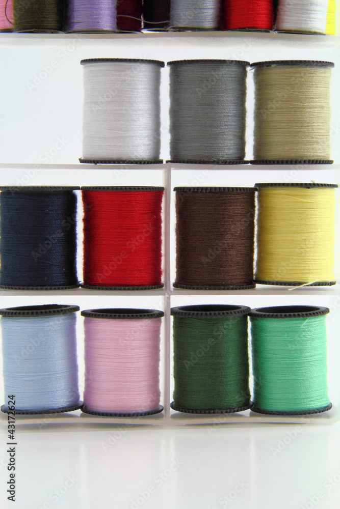 Stacked spools of thread.