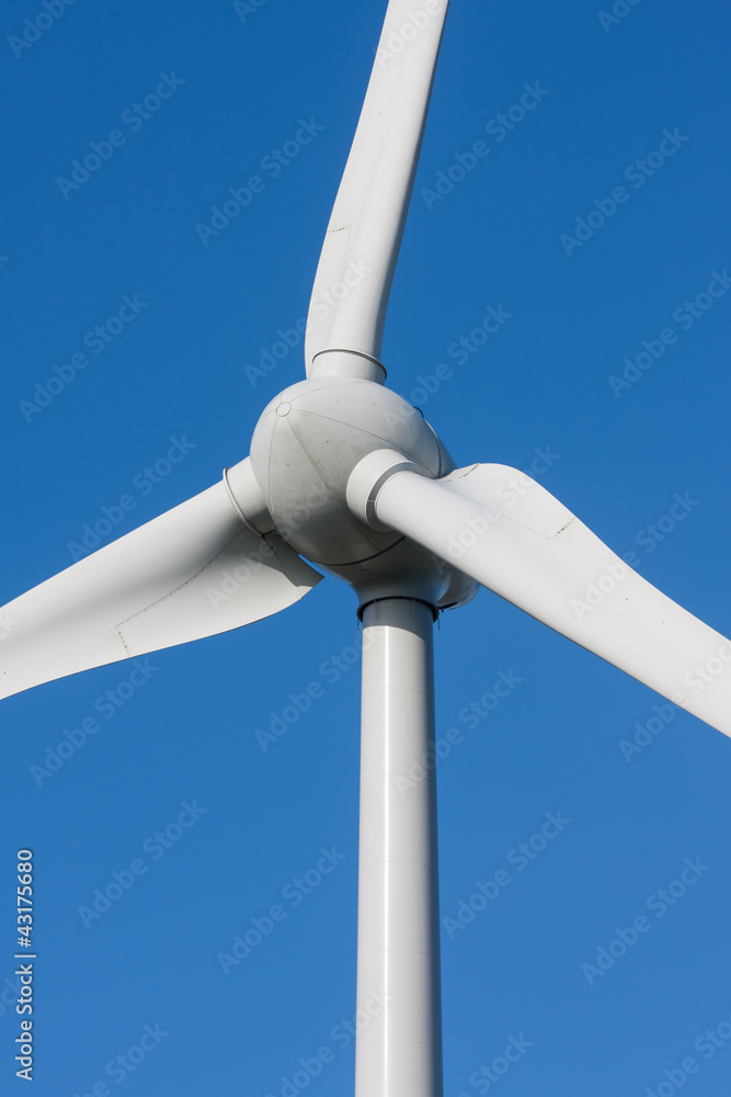 Big white windmill with blue and clear sky Big white windmill with blue and clear sky