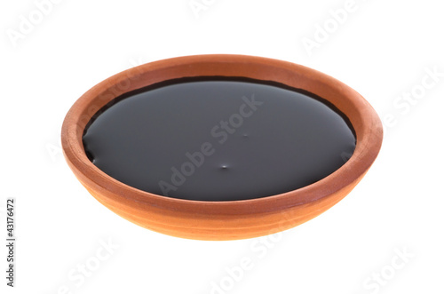 Dish of molasses photo