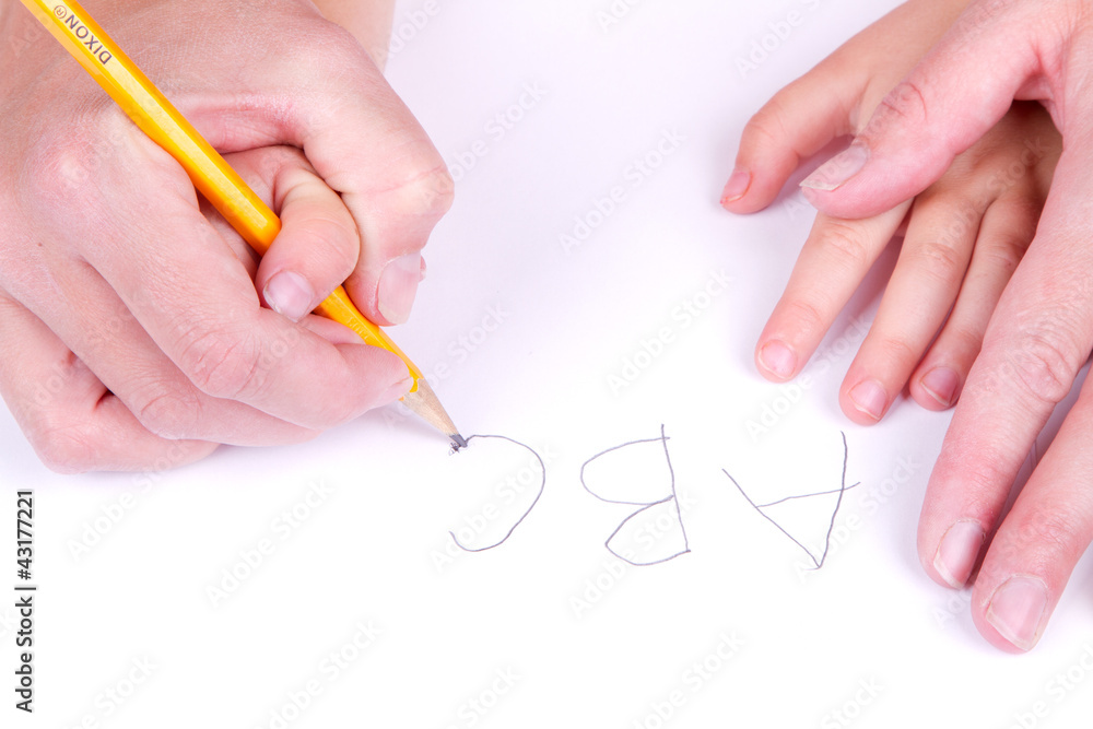 mother helping daughter write alphabet mother helping daughter write alphabet
