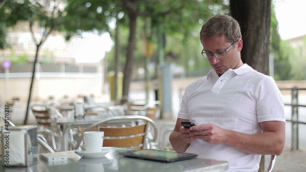 Young handsome man using smartphone, outdoors Young handsome man using smartphone, outdoors
