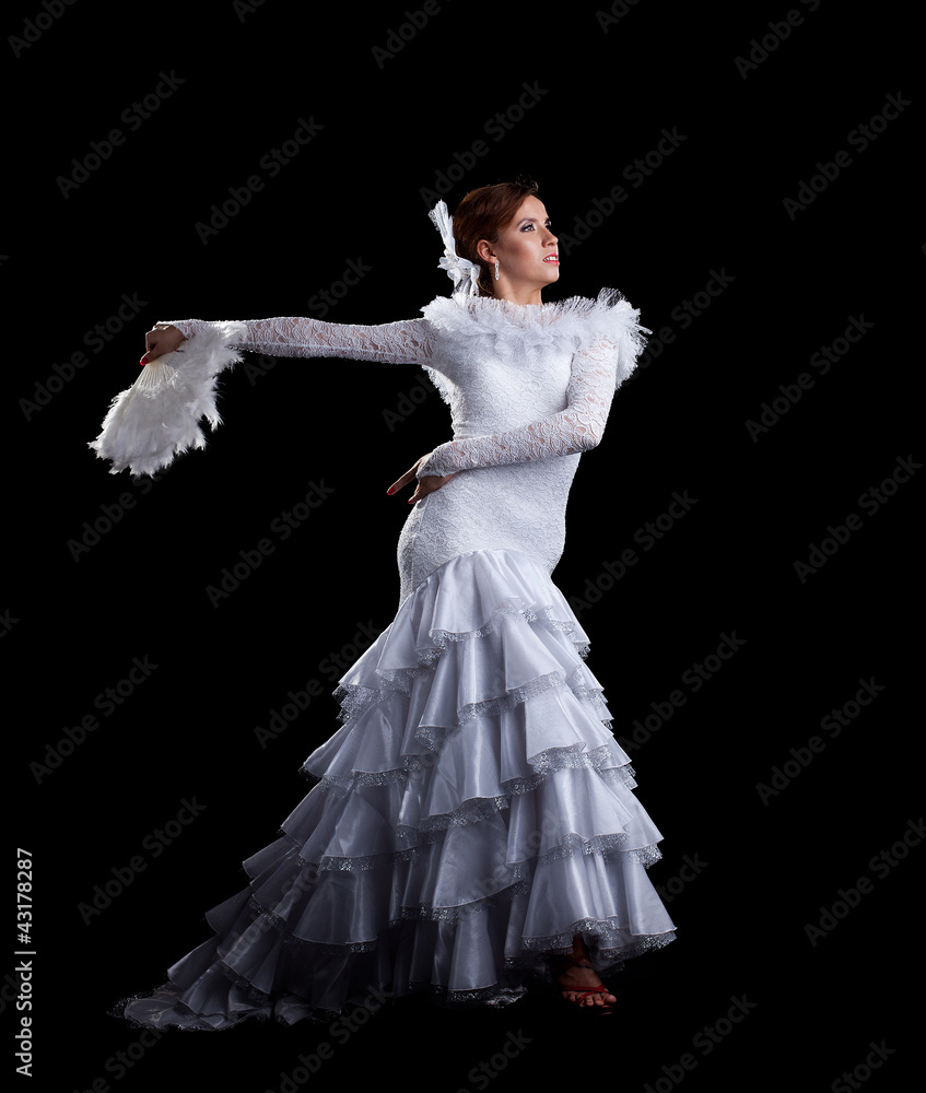 Fototapeta premium Young woman dance in white flamenco costume