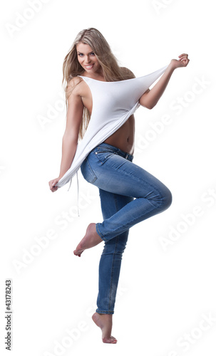 Beautiful woman stand in jeans and tank top