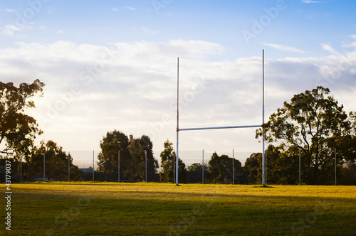 Goal posts for rugby union or rugby league football on a field at sunset in Australia