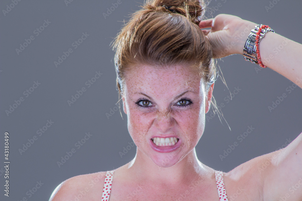 Beautiful angry girl, with freckles