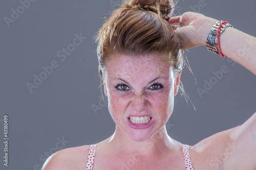 Obraz na płótnie Beautiful angry girl, with freckles w salonie