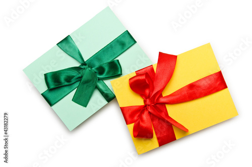 Envelope with colourful ribbon on white