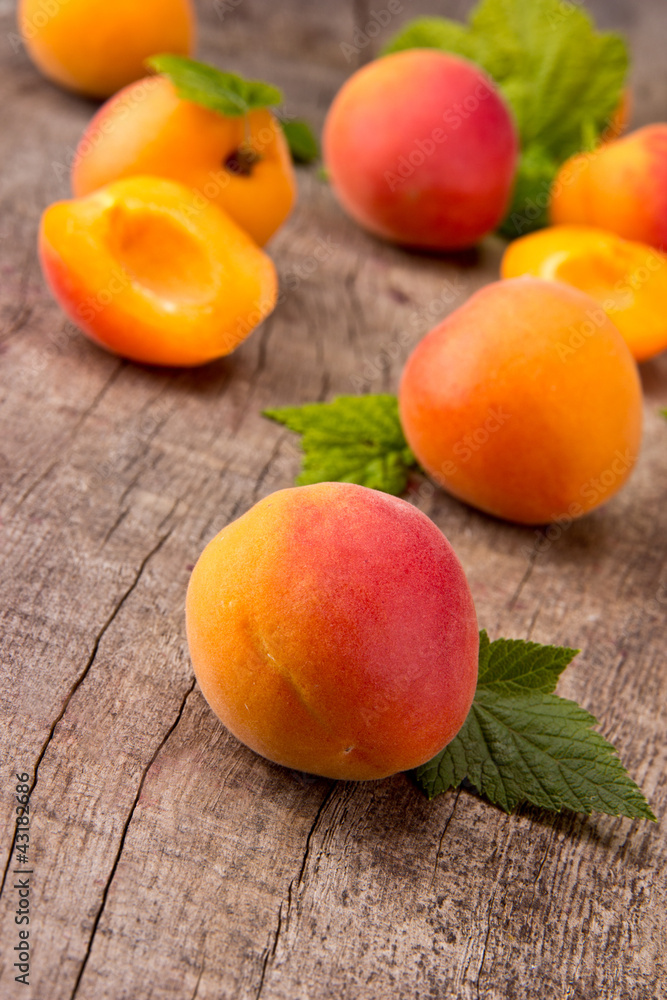 Fresh apricots on wooden table Fresh apricots on wooden table