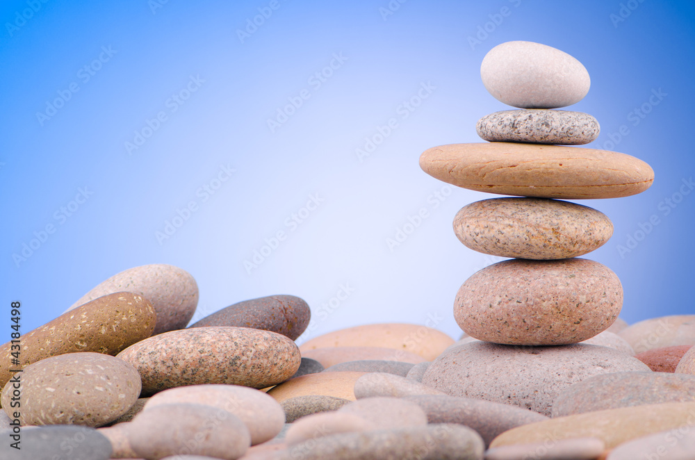 Pebbles stack against gradient background Pebbles stack against gradient background