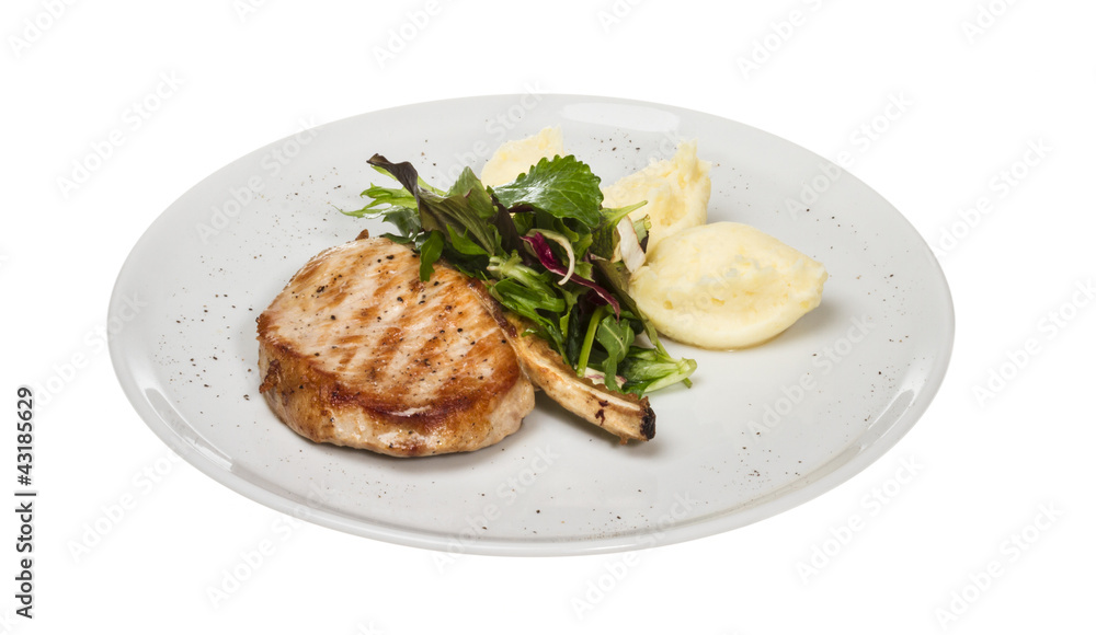 Grilled pork with salad and potato Grilled pork with salad and potato