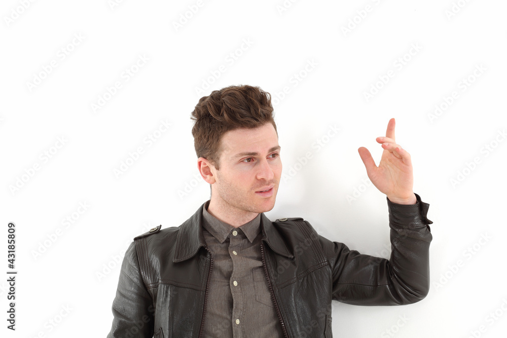Young adult man posing with leather jacket