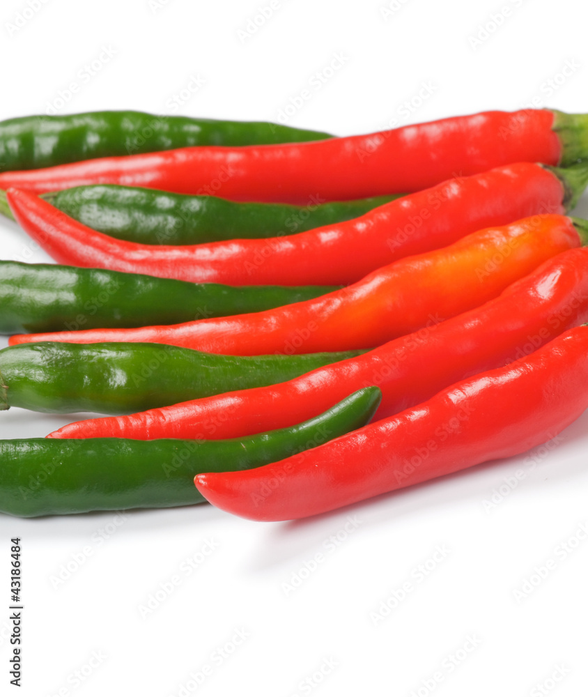 Arrangement of green and red chili peppers