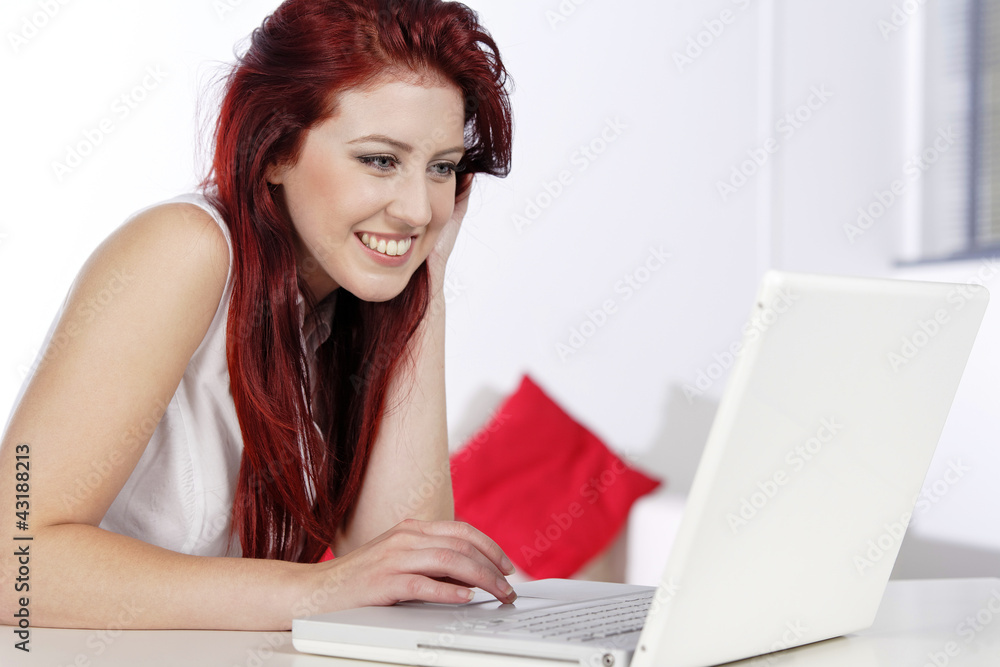 Woman using laptop at home Woman using laptop at home