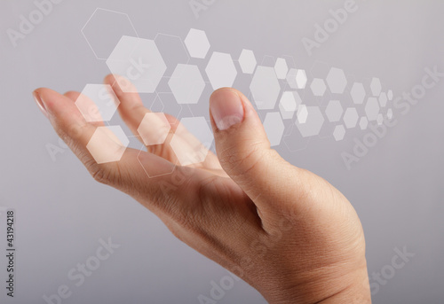 hand holds touch screen interface screen