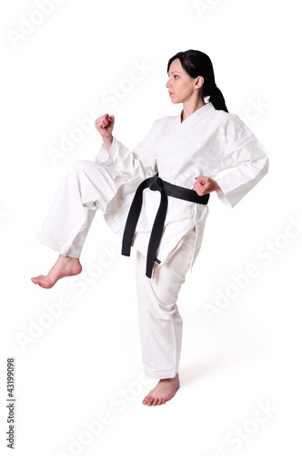 Karate woman posing on a white background