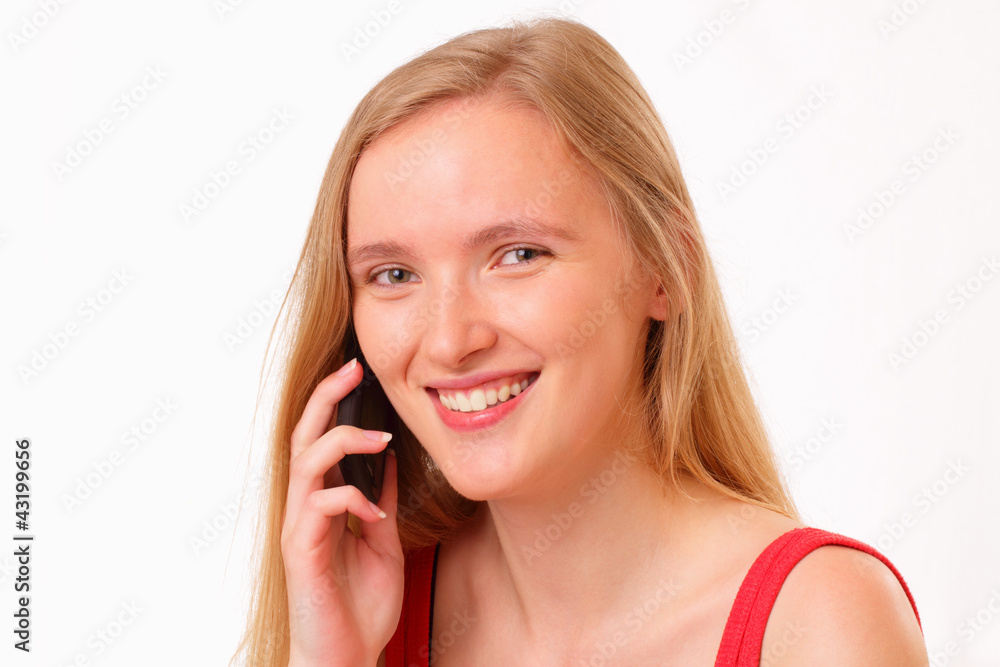 Smiling young girl talking on the mobile phone Smiling young girl talking on the mobile phone