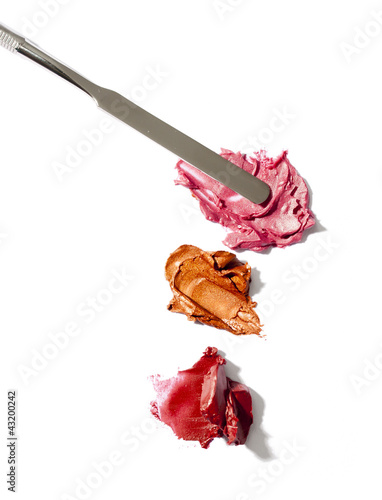 lipstick samples on white background and spatula