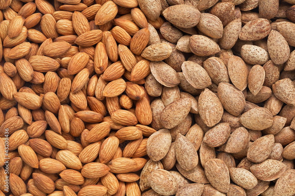 Peeled, unpeeled almonds. More food backgrounds in my portfolio Peeled, unpeeled almonds. More food backgrounds in my portfolio
