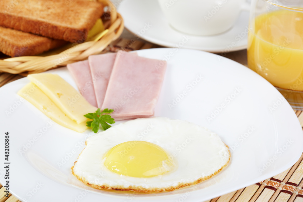 Breakfast. Fried eggs with cheese and ham Breakfast. Fried eggs with cheese and ham
