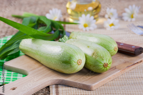 vegetable marrows on a wooden board
