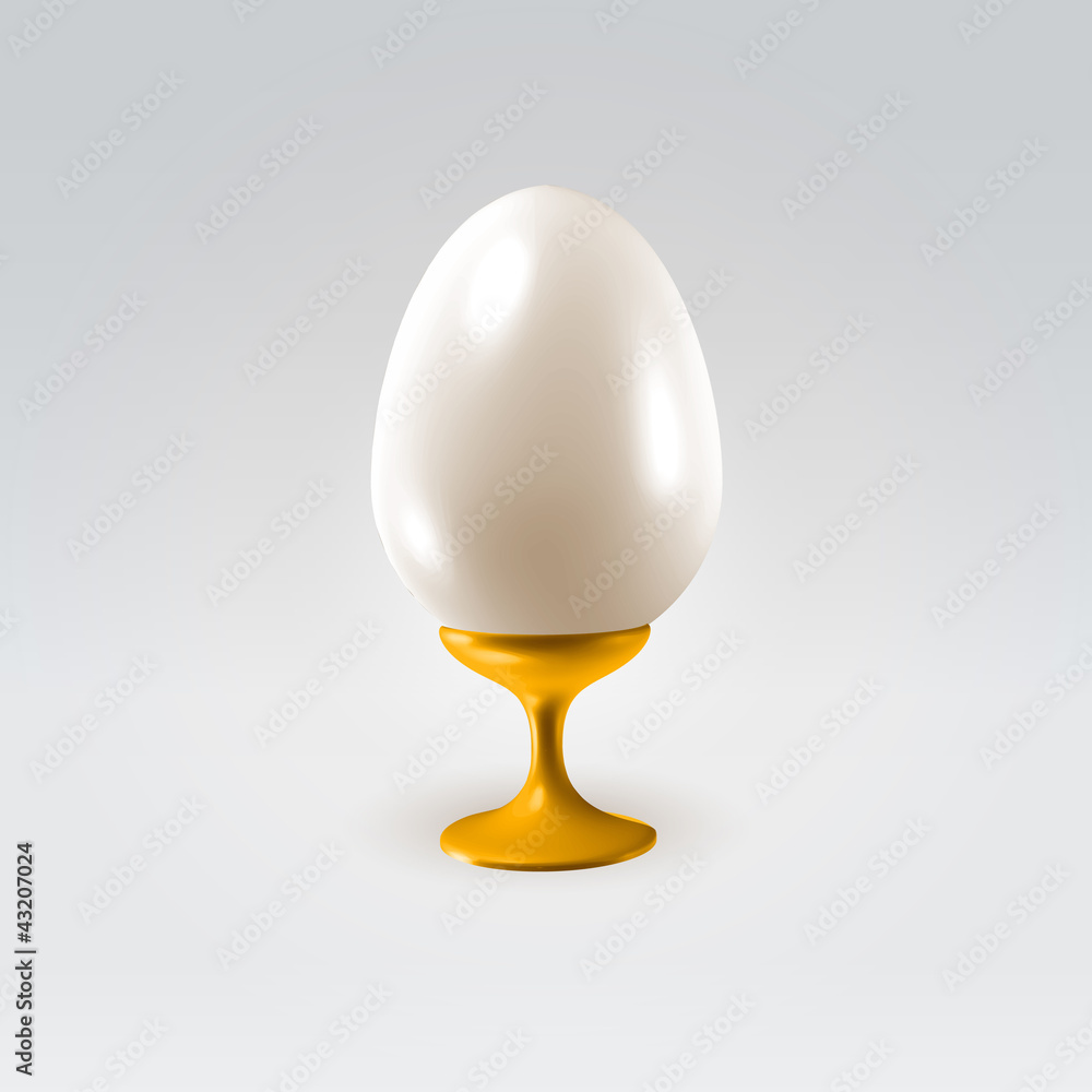 Shining pearl egg on a golden handle Shining pearl egg on a golden handle