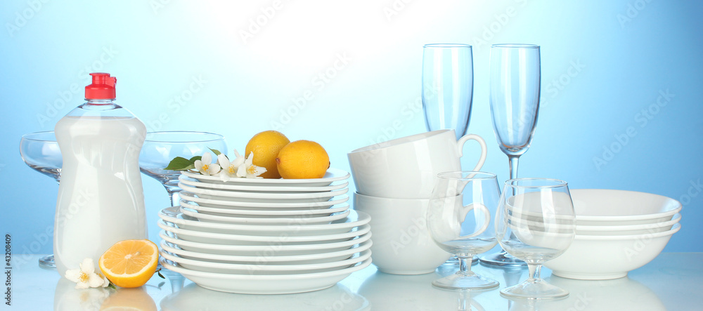empty clean plates, glasses and cups with dishwashing liquidand empty clean plates, glasses and cups with dishwashing liquidand