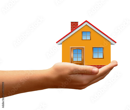 The house in hands isolated on white background