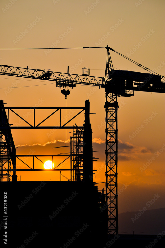 silhouette crane building and sunset of Southeast Asia