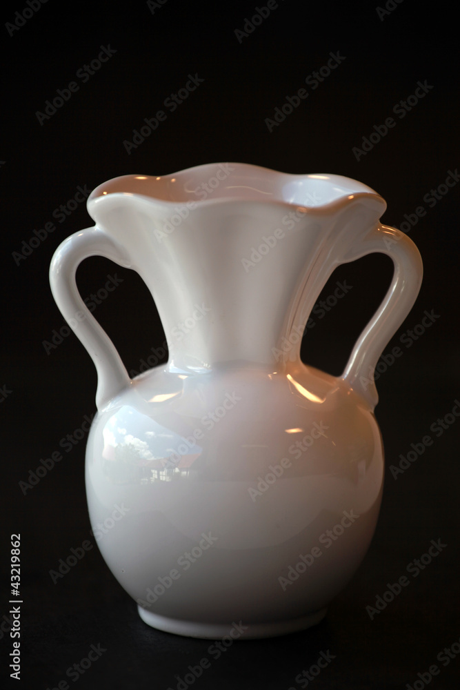 White vase on black background