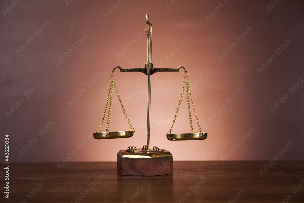 Law concept with wooden table and dark background
