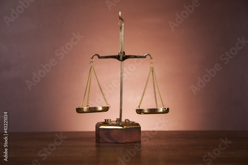 Law concept with wooden table and dark background
