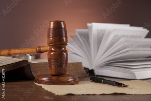 Law concept with wooden table and dark background