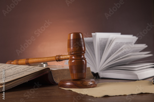 Law and justice stuff on wood table and dark background 