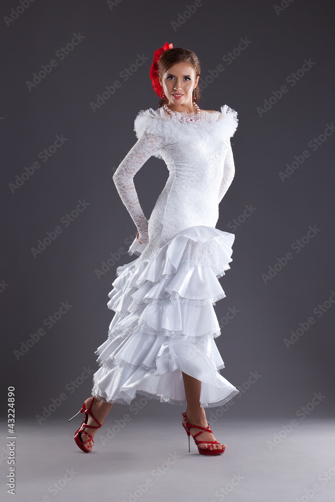 Fototapeta premium Young woman dance in white flamenco costume