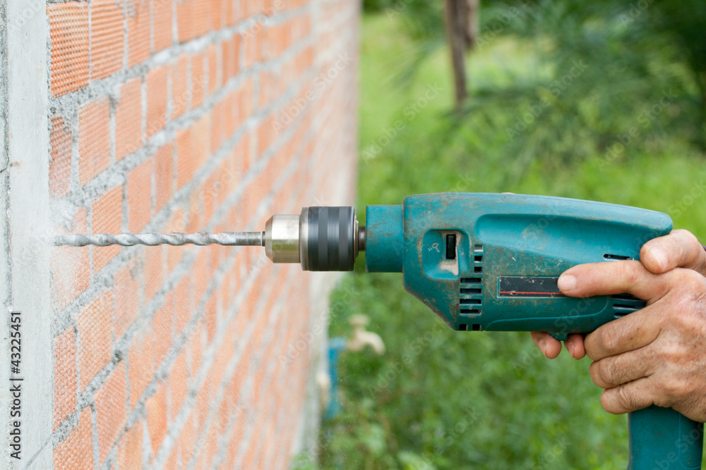 Drilling the wall with electric drill 1 Drilling the wall with electric drill 1
