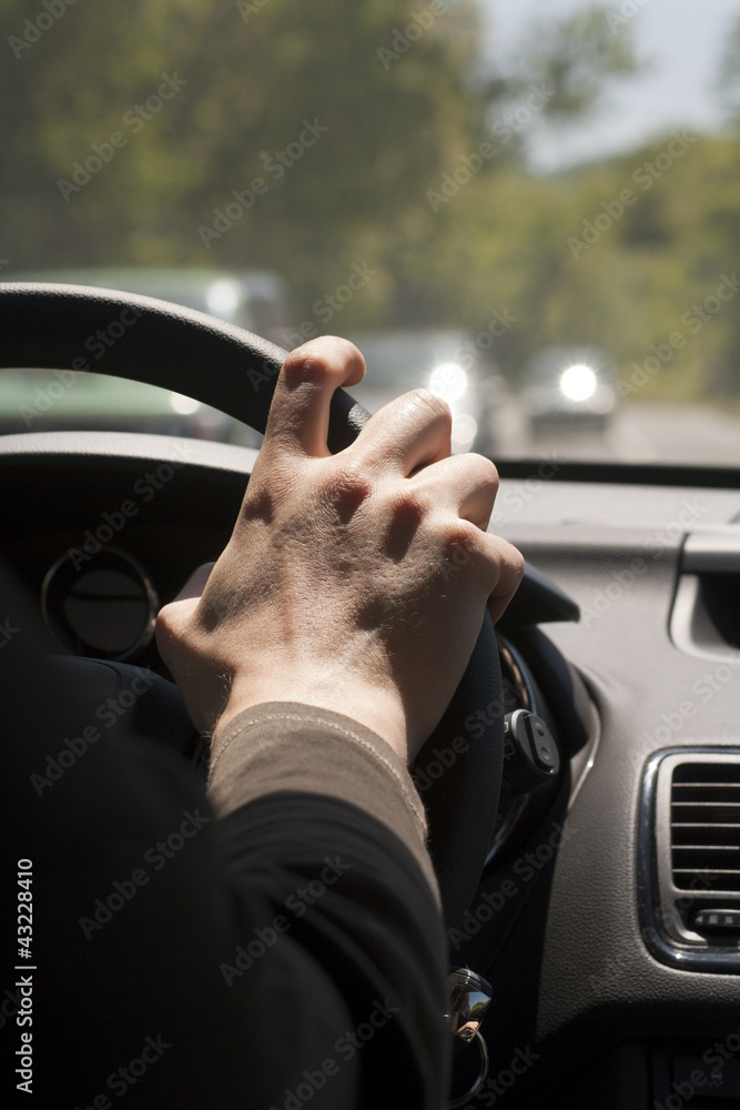 Hand on steering wheel Hand on steering wheel