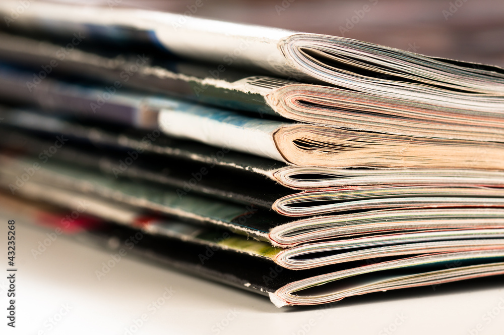 A large stack of magazines piled high. A large stack of magazines piled high.