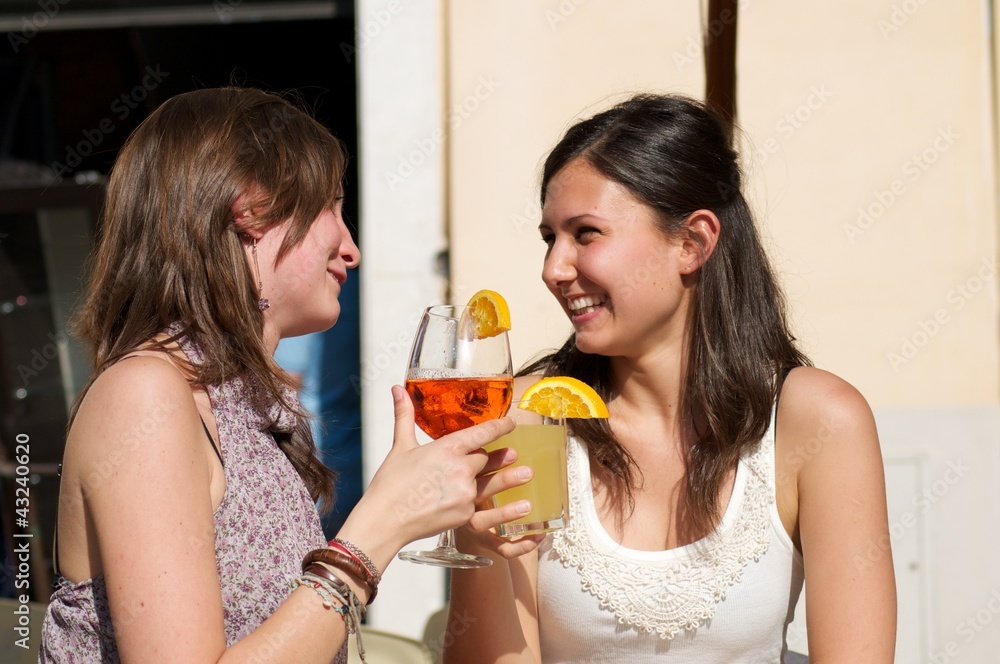 Two Girls While They Take a Cocktail Two Girls While They Take a Cocktail