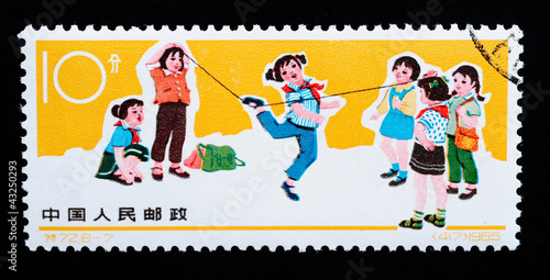Stamp printed in China shows girls playing rubber band skipping
