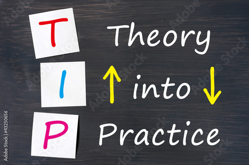 TIP acronym for theory into practice written on a blackboard