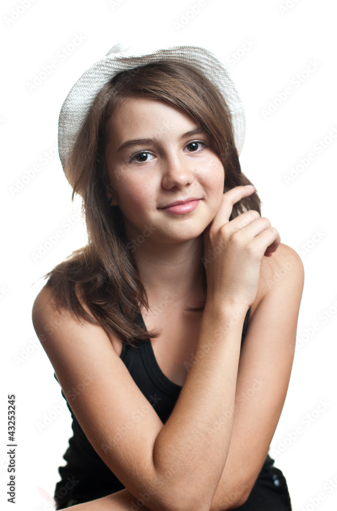 Beautiful young multicultural girl wearing a hat in a studio Beautiful young multicultural girl wearing a hat in a studio