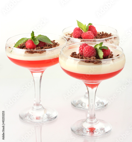 fruit jelly with chocolate and raspberries in glasses isolated