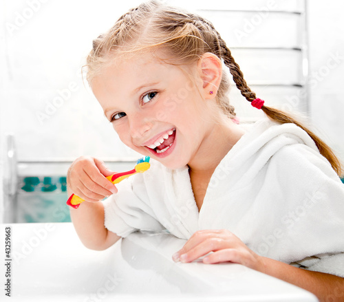 Little girl brushing teeth #43259663