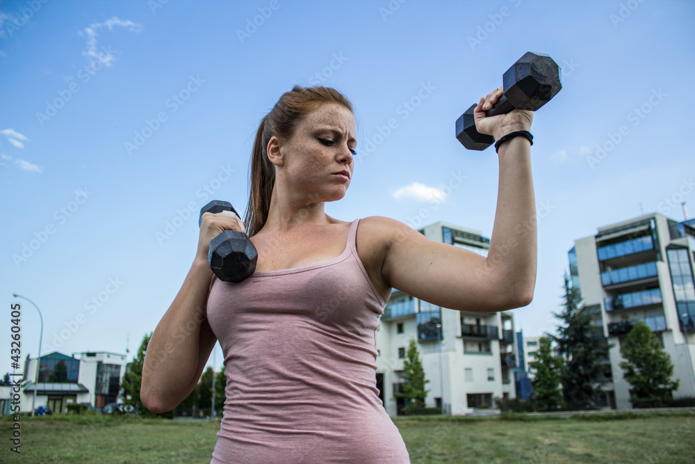 Sensual girl keep fit in a urban landscape