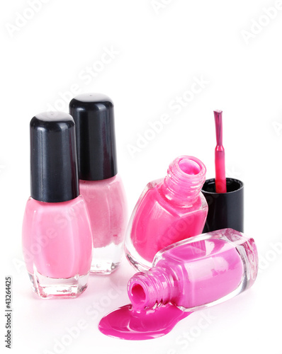 open bottles with bright nail polish isolated on white