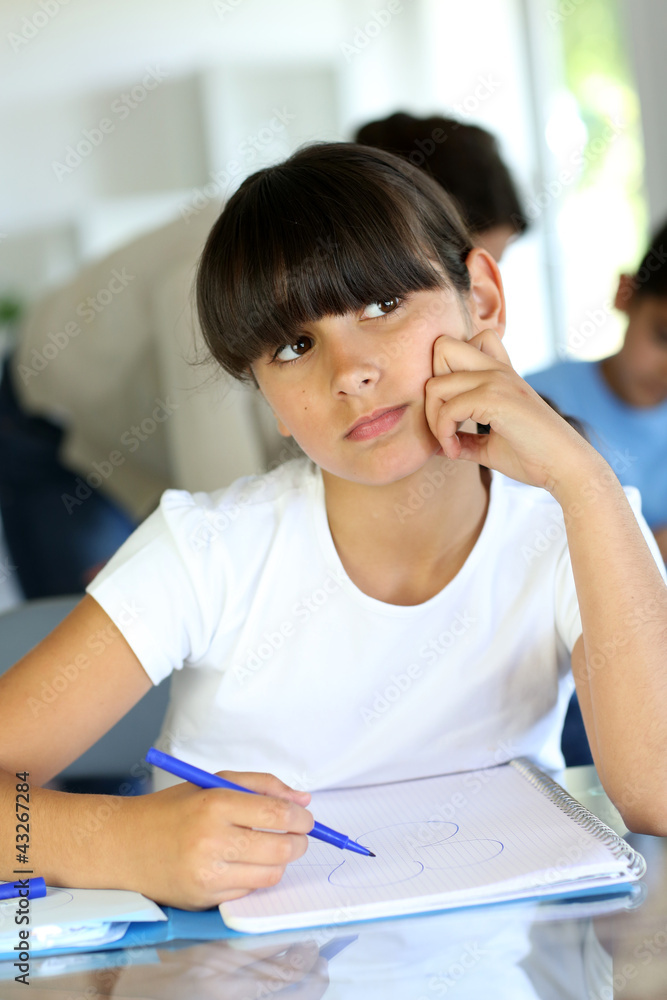 Young school girl with bored look on her face Young school girl with bored look on her face