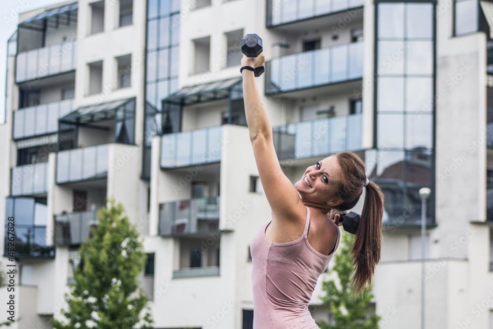 Sensual girl keep fit in a urban landscape