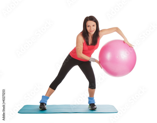 Fototapeta Naklejka Na Ścianę i Meble -  Attractive young female with fitness ball in stretching